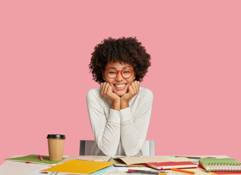 glad-ethnic-wonk-wears-glasses-has-toothy-smile-prepares-upcoming-exam (1)