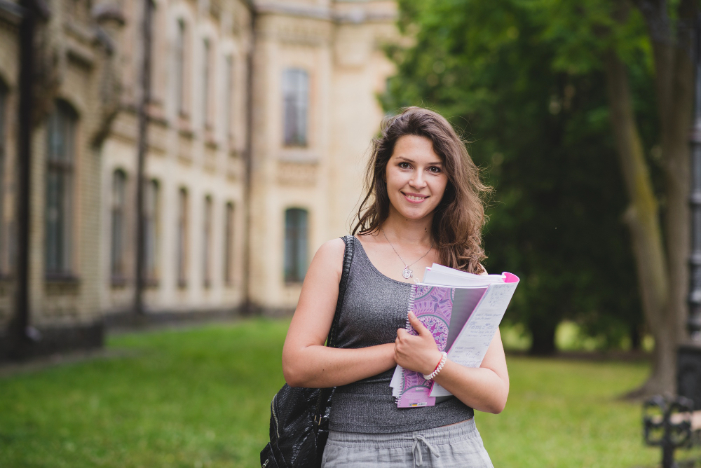 brunette girl holding card boards standing